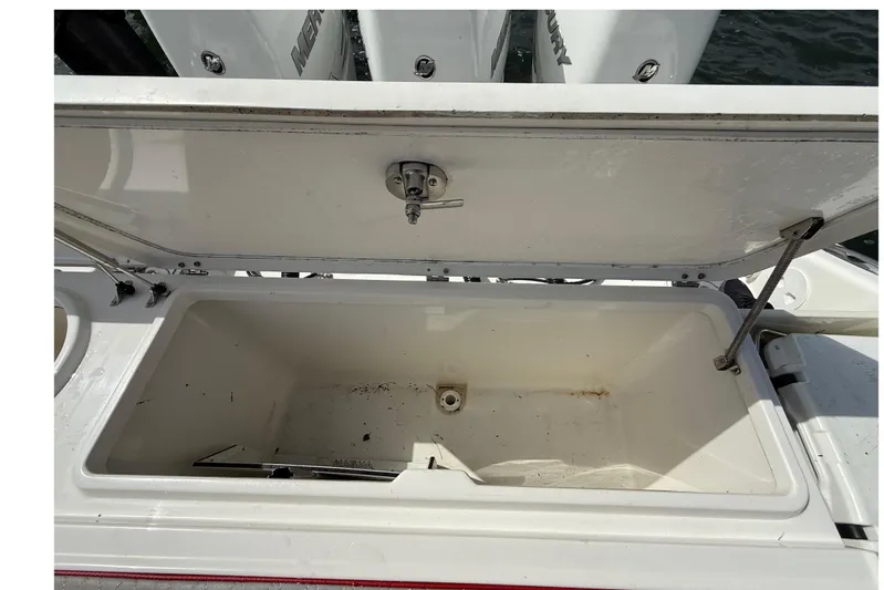  Yacht Photos Pics Open storage compartment on 2010 Triton 351 Express boat, showing interior details.