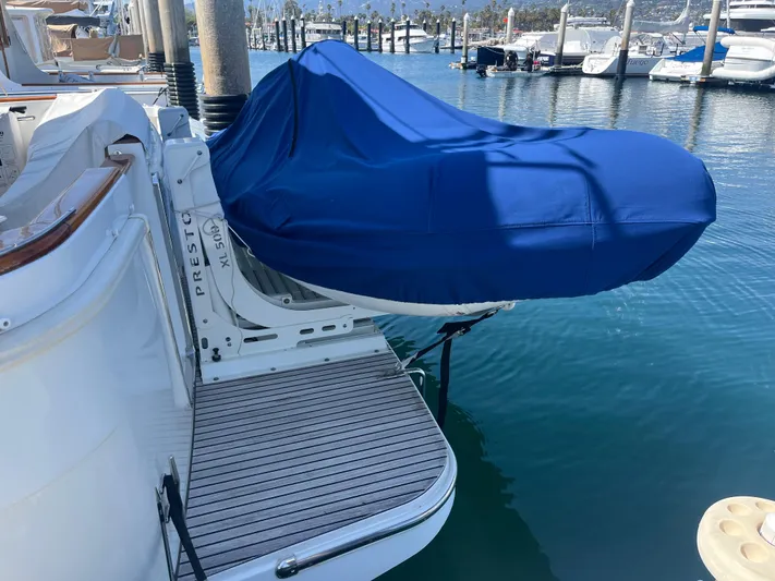 Eleven Seven Yacht Photos Pics 2013 Beneteau Swift Trawler 34 with covered equipment on deck at marina.