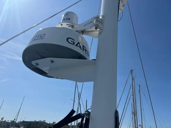 Eleven Seven Yacht Photos Pics Radar equipment on a 2013 Beneteau Swift Trawler 34 under clear blue sky.