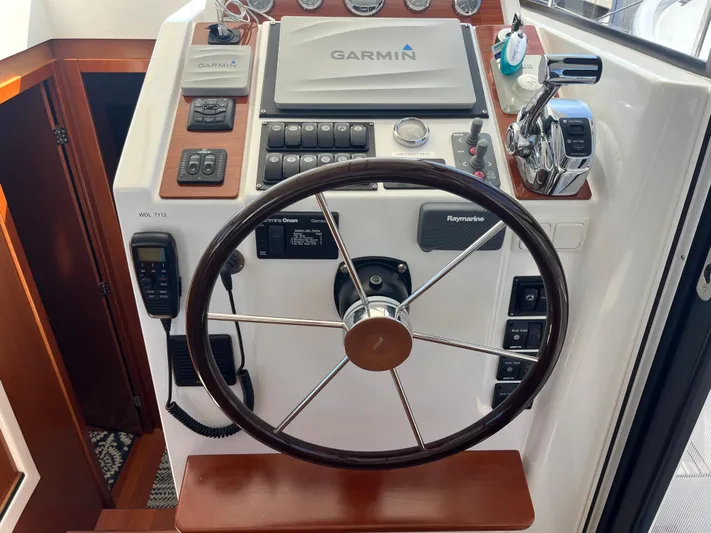 Eleven Seven Yacht Photos Pics Helm of 2013 Beneteau Swift Trawler 34 with Garmin navigation system.