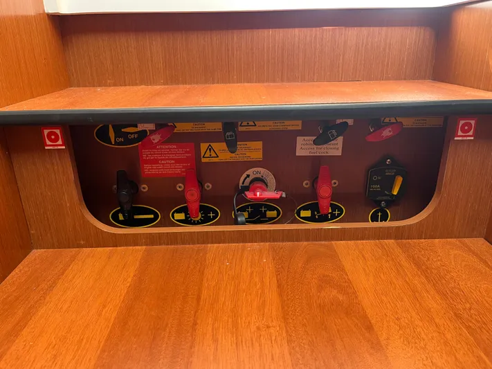 Eleven Seven Yacht Photos Pics Electrical panel of 2013 Beneteau Swift Trawler 34 with switches and safety labels.