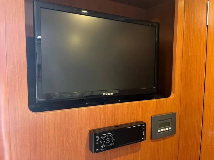 Eleven Seven Yacht Photos Pics Samsung TV and control panel on 2013 Beneteau Swift Trawler 34 interior wood paneling.