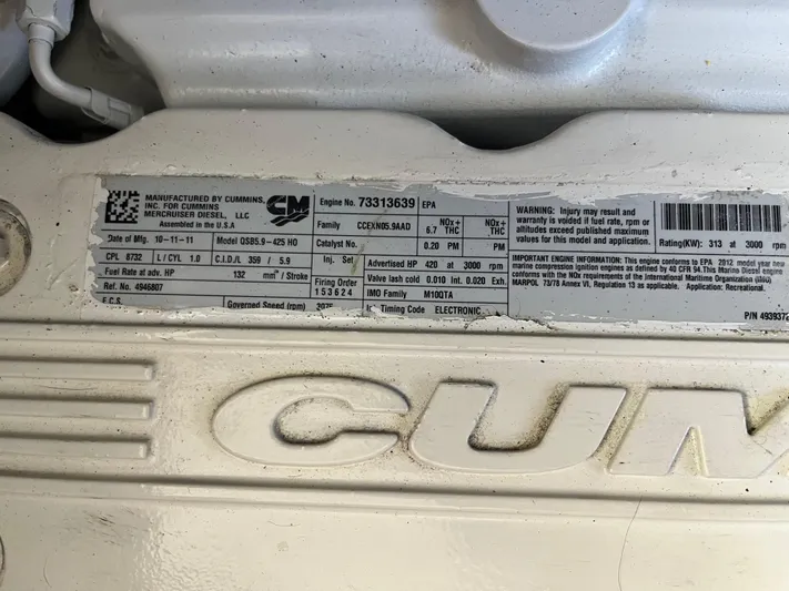 Eleven Seven Yacht Photos Pics Engine label on a 2013 Beneteau Swift Trawler 34, featuring Cummins specifications.