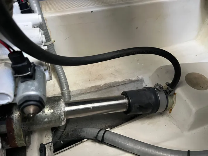 Eleven Seven Yacht Photos Pics Engine compartment of a 2013 Beneteau Swift Trawler 34, showing mechanical components and hoses.