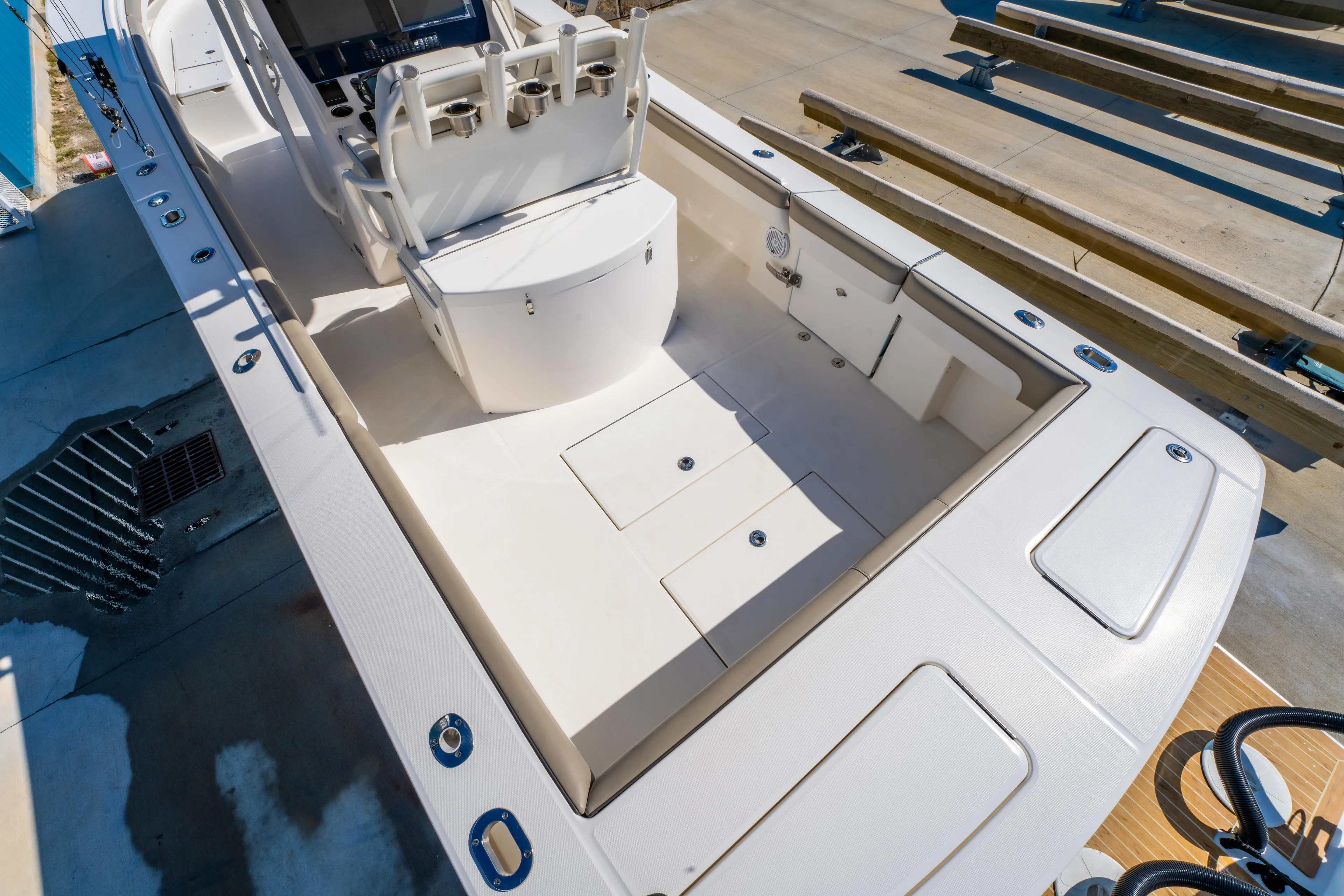 Yacht Photos Pics 2019 Regulator 34 boat interior with seating and storage compartments.