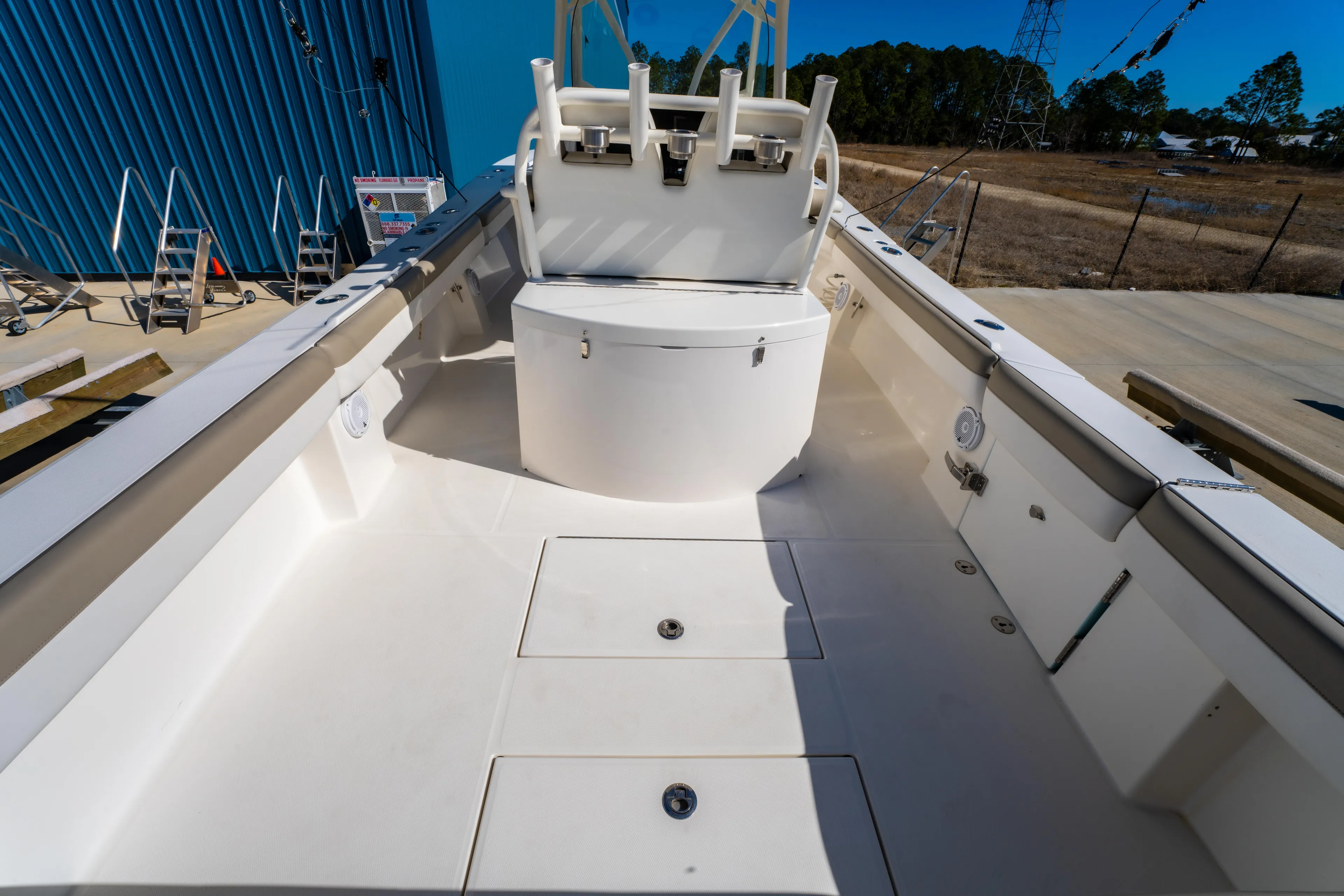  Yacht Photos Pics 2019 Regulator 34 boat deck with seating and storage compartments.