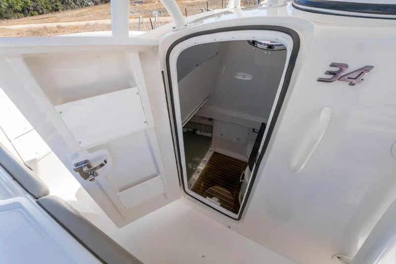 Yacht Photos Pics 2019 Regulator 34 boat cabin entrance with open door, showcasing interior space.