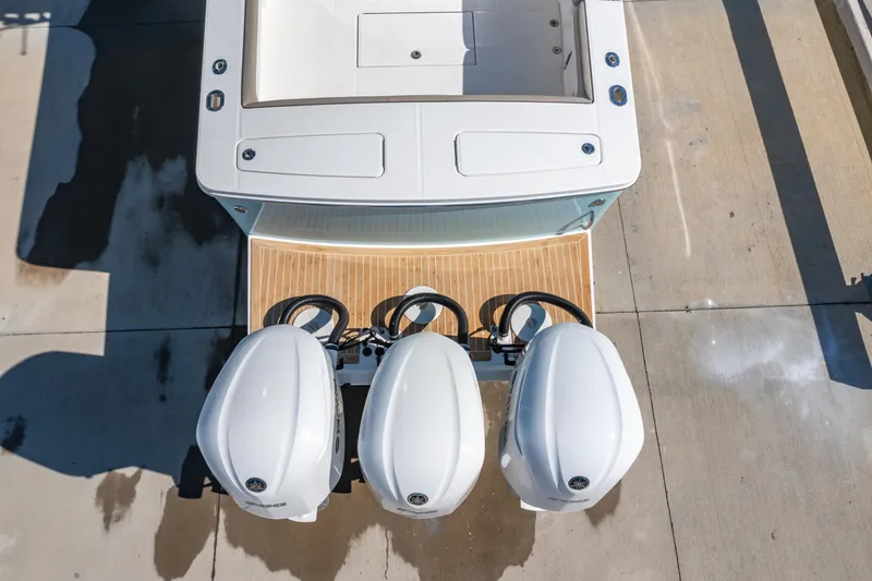  Yacht Photos Pics 2019 Regulator 34 boat with triple outboard engines, aerial view.