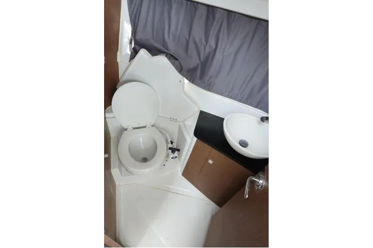  Yacht Photos Pics 2021 Jeanneau NC 895 boat bathroom with toilet and sink.