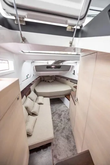  Yacht Photos Pics 2024 Axopar 45 XC Cross Cabin BRABUS Trim interior with modern seating and cozy bed.