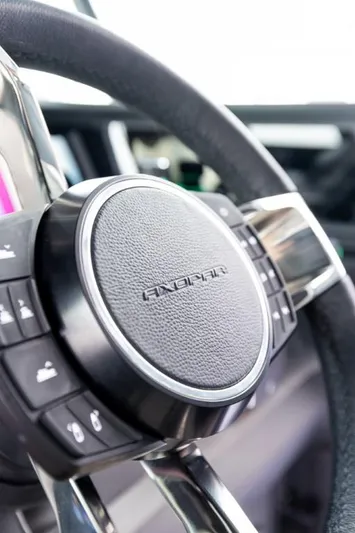  Yacht Photos Pics Steering wheel of 2024 Axopar 45 XC Cross Cabin BRABUS Trim boat, close-up view.