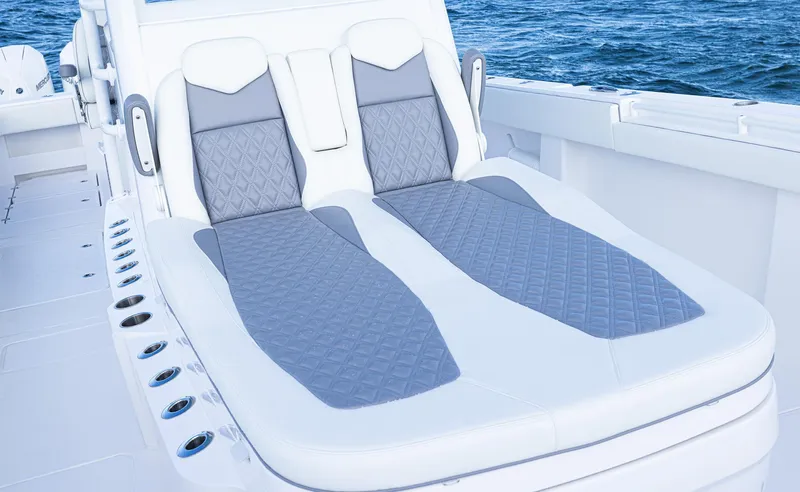  Yacht Photos Pics 2025 Invincible 35 Catamaran with luxurious seating, ocean backdrop.