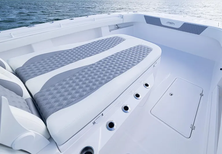  Yacht Photos Pics 2025 Invincible 35 Catamaran with cushioned seating and ocean view.