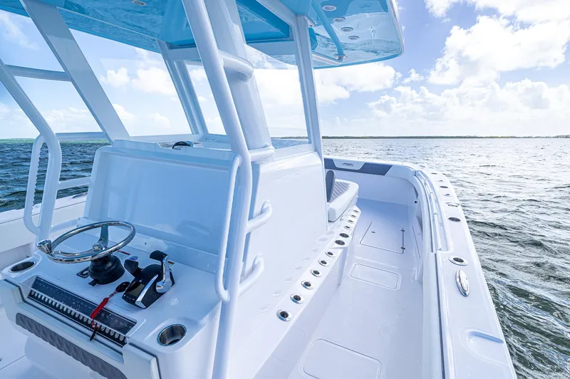  Yacht Photos Pics 2025 Invincible 35 Catamaran on open water, showcasing sleek design and spacious deck.