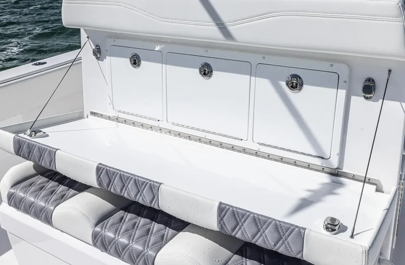  Yacht Photos Pics 2025 Invincible 35 Catamaran seating with storage compartments, quilted cushions, and sleek design.