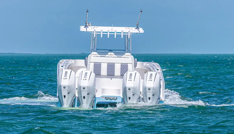  Yacht Photos Pics 2025 Invincible 35 Catamaran with quad engines cruising on open water.