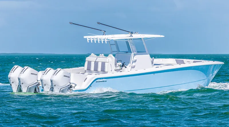  Yacht Photos Pics 2025 Invincible 35 Catamaran cruising on open water with triple outboard engines.