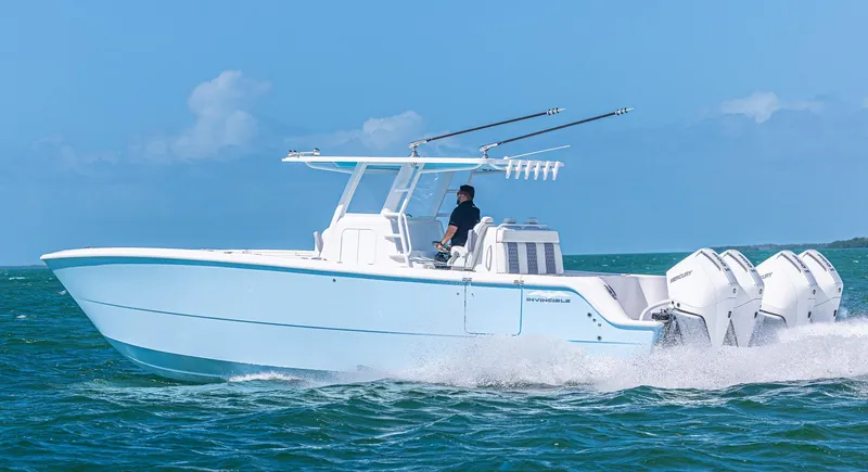  Yacht Photos Pics 2025 Invincible 35 Catamaran cruising on open water, showcasing sleek design and powerful engines.