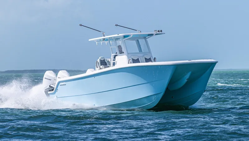  Yacht Photos Pics 2025 Invincible 35 Catamaran cruising on open water.