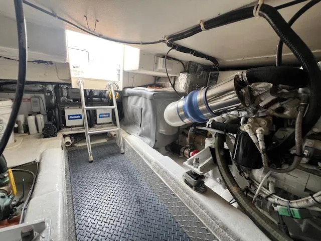 Fryedays Off Yacht Photos Pics Engine room of 2003 Ocean Yachts 43 Super Sport, featuring mechanical components and ladder access.