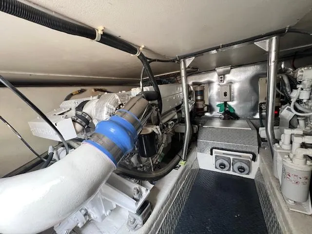 Fryedays Off Yacht Photos Pics Engine room of 2003 Ocean Yachts 43 Super Sport, showcasing mechanical components and piping.