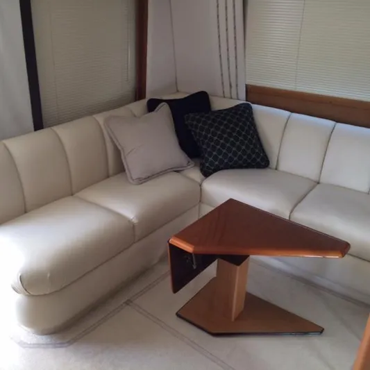 Fryedays Off Yacht Photos Pics Luxurious interior of 2003 Ocean Yachts 43 Super Sport with elegant seating and modern table.