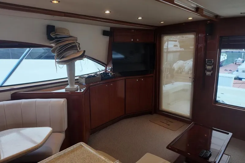  Yacht Photos Pics Luxurious interior of a 2007 Bertram 510 Convertible yacht with elegant wood finishes.