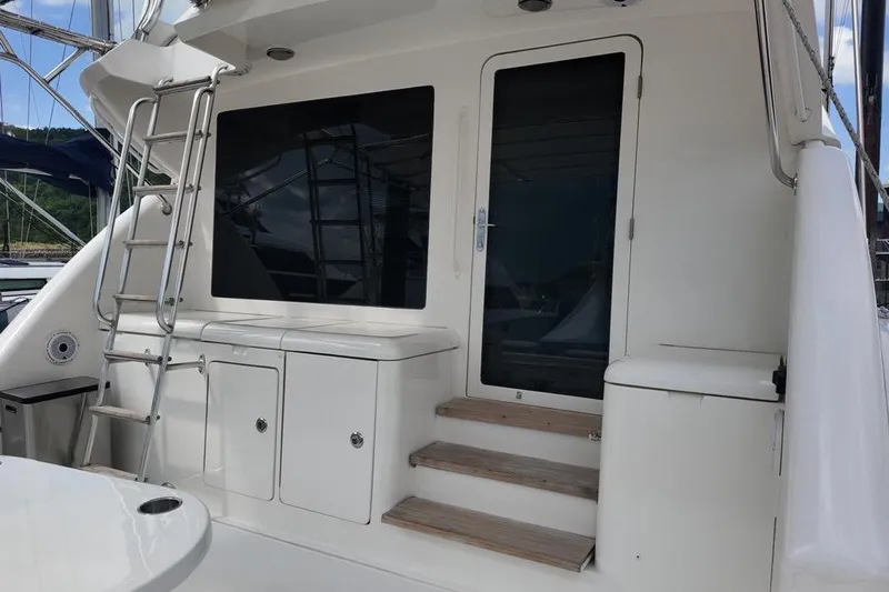  Yacht Photos Pics 2007 Bertram 510 Convertible yacht with ladder and cabin entrance.