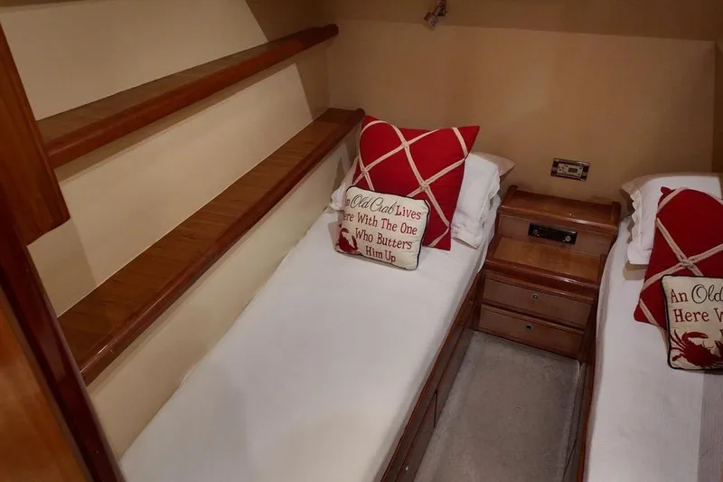  Yacht Photos Pics Cozy twin cabin in 2007 Bertram 510 Convertible yacht with decorative pillows.