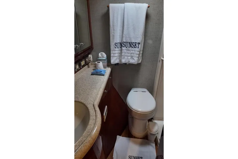  Yacht Photos Pics Bathroom interior of 2007 Bertram 510 Convertible yacht with towels and amenities.