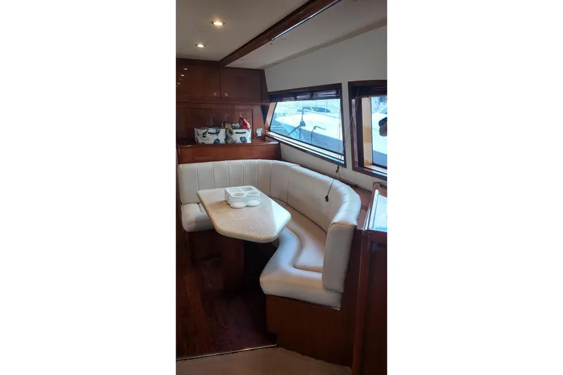 Yacht Photos Pics Interior of 2007 Bertram 510 Convertible yacht with elegant dining area and plush seating.