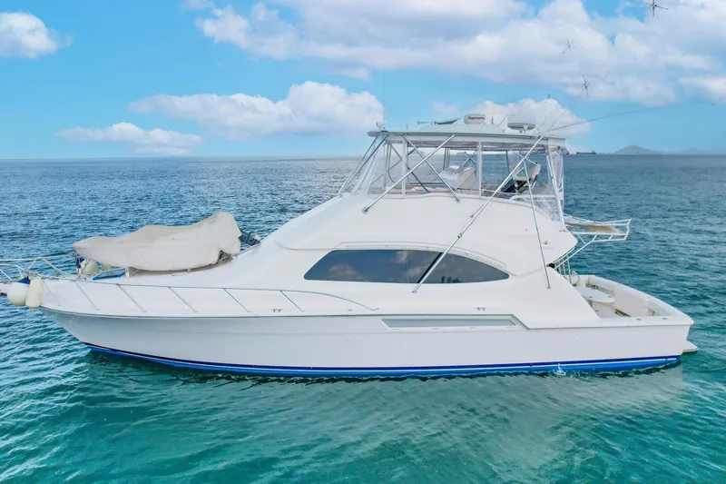  Yacht Photos Pics 2007 Bertram 510 Convertible yacht on calm ocean waters under blue sky.