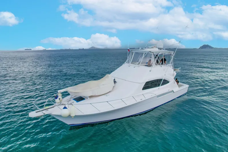  Yacht Photos Pics 2007 Bertram 510 Convertible yacht cruising on open sea under blue sky.