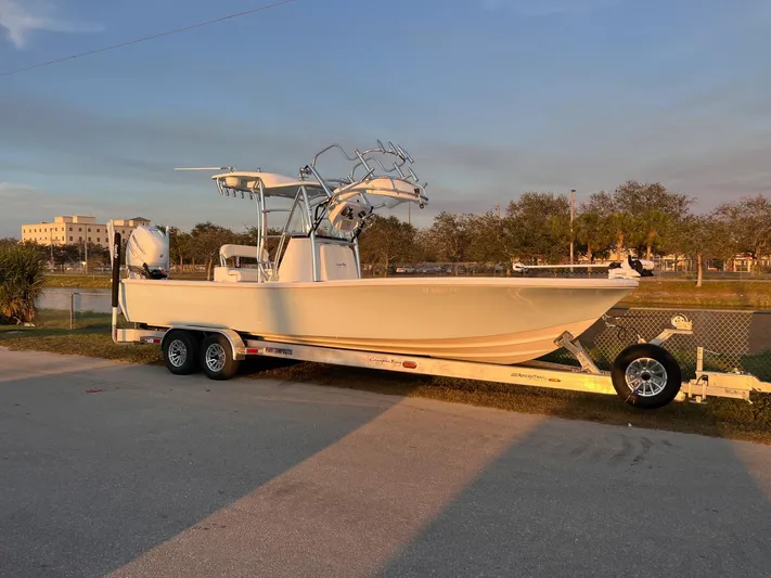  Yacht Photos Pics 2022 Canyon Bay 28h boat on trailer, parked outdoors at sunset.
