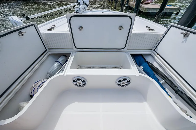  Yacht Photos Pics 2022 Canyon Bay 28h boat storage compartments with open hatches and organized gear.