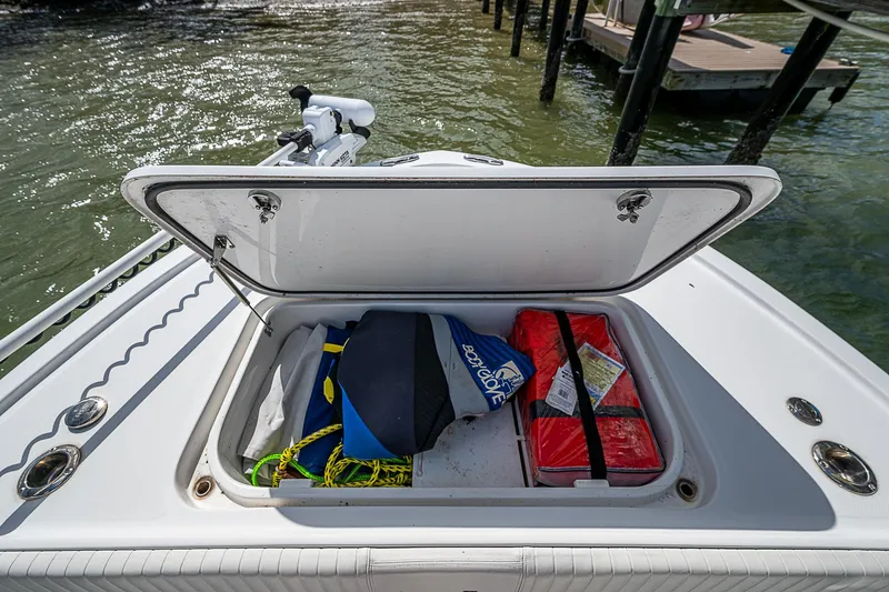  Yacht Photos Pics Open storage compartment on 2022 Canyon Bay 28h boat with life jackets and gear.