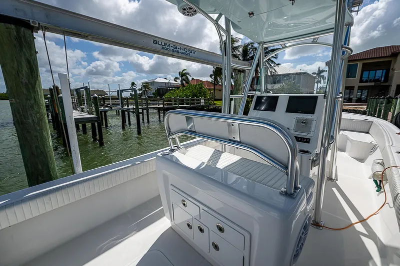  Yacht Photos Pics 2022 Canyon Bay 28h boat interior with modern console and waterfront view.