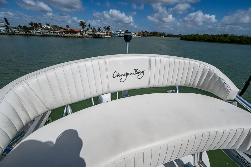  Yacht Photos Pics Canyon Bay 28h boat seat with scenic water view, 2022 model.