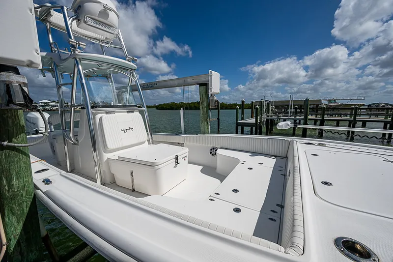  Yacht Photos Pics 2022 Canyon Bay 28h boat docked under a clear blue sky.