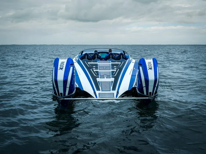  Yacht Photos Pics 2024 MTI 440X powerboat on open water under cloudy skies.