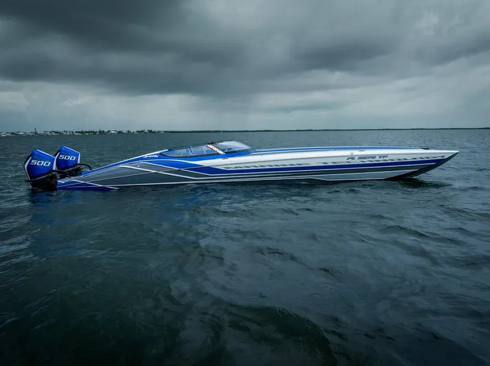  Yacht Photos Pics 2024 MTI 440X speedboat on water under cloudy sky, featuring dual 500 engines.