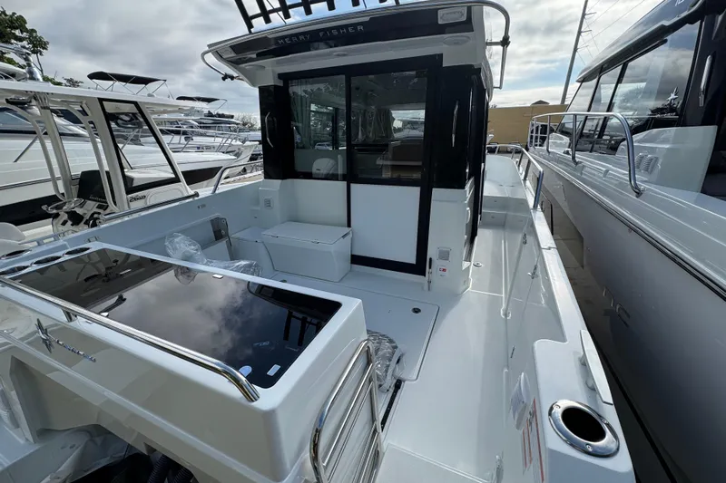  Yacht Photos Pics 2026 Jeanneau NC 895 Series 2 boat, spacious deck, modern design, docked at marina.