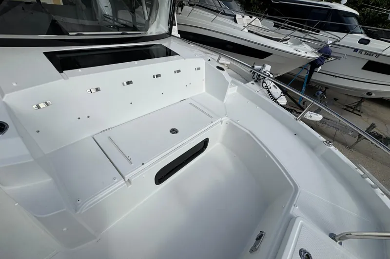 Yacht Photos Pics 2026 Jeanneau NC 895 Series 2 boat deck, featuring sleek white design and spacious layout.