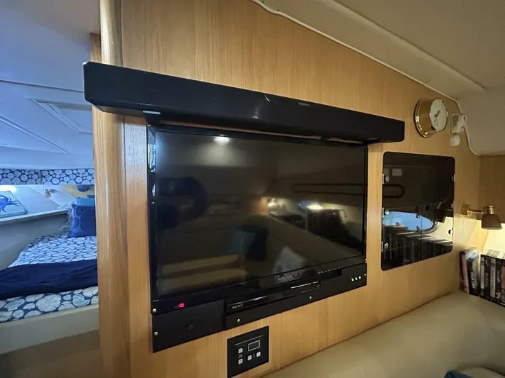 Native Dancer Yacht Photos Pics Interior of 2002 Tiara Yachts 3800 Open with TV and cozy cabin.