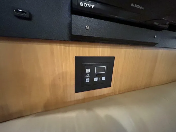 Native Dancer Yacht Photos Pics Control panel on 2002 Tiara Yachts 3800 Open, beneath Sony Insignia equipment.