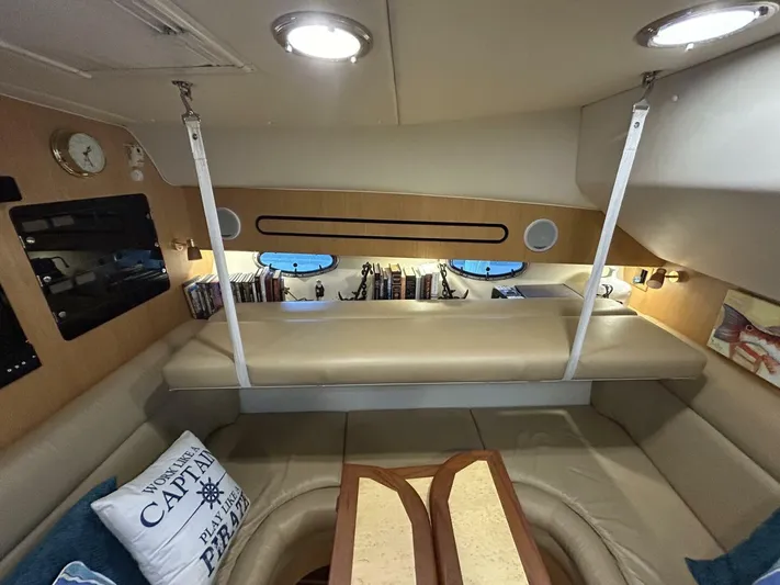 Native Dancer Yacht Photos Pics Interior of 2002 Tiara Yachts 3800 Open, featuring cozy seating and nautical decor.