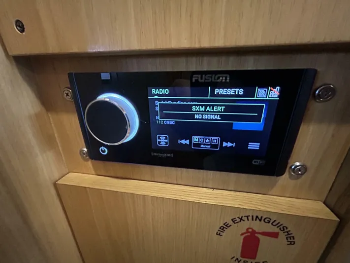 Native Dancer Yacht Photos Pics Fusion radio system on 2002 Tiara Yachts 3800 Open, displaying "SXM Alert" message.