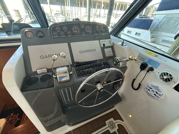 Native Dancer Yacht Photos Pics Helm of 2002 Tiara Yachts 3800 Open with Garmin navigation system.