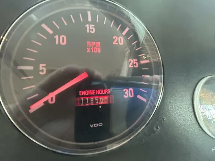 Native Dancer Yacht Photos Pics Close-up of Tiara Yachts 3800 Open 2002 tachometer showing 1185 engine hours.