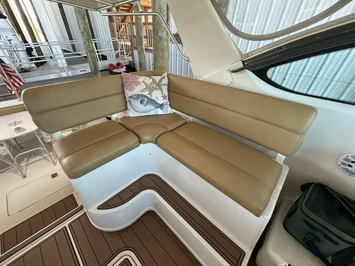 Native Dancer Yacht Photos Pics 2002 Tiara Yachts 3800 Open interior with tan seating and decorative pillow.